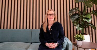 Lucy Darch, CEO of Wave, seated in an office setting
