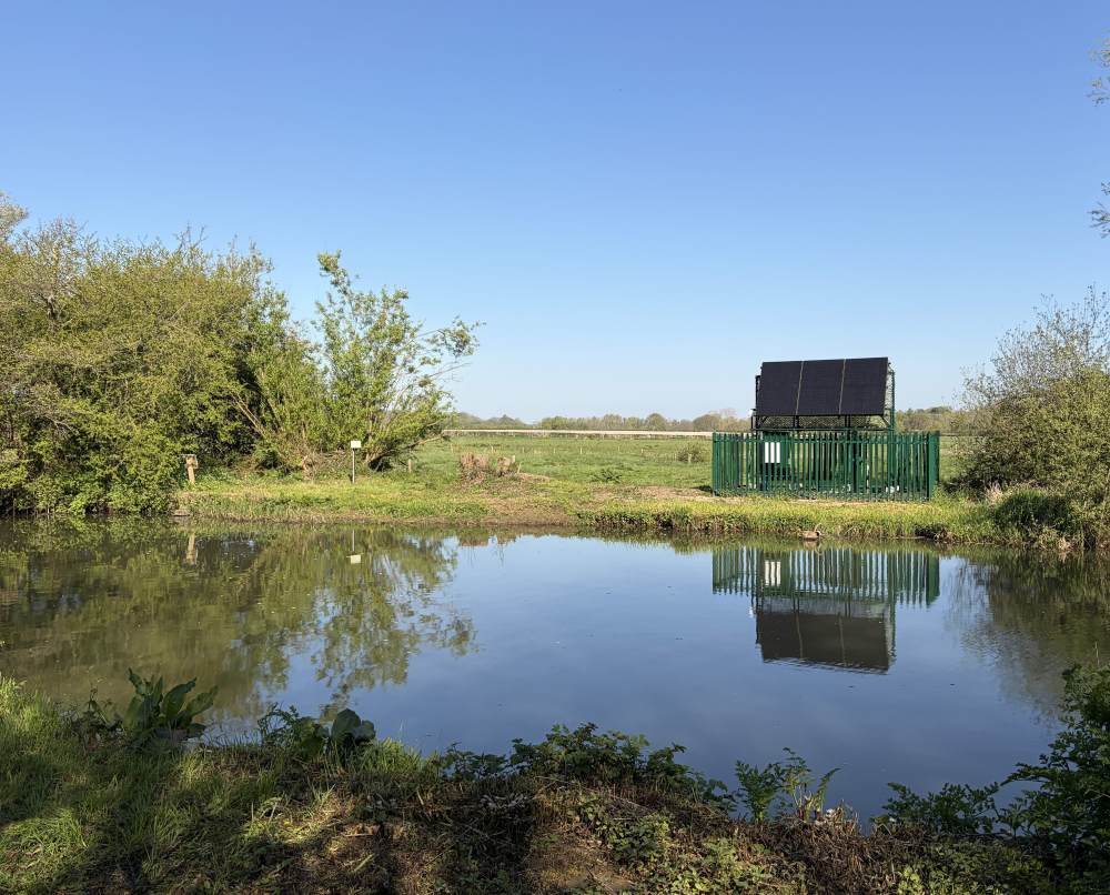Solar-powered NIVUS wireless transit-time flow monitor installed beside the River Ouse at Barcombe Mills