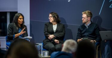 Three speakers taking part in a panel discussion at Utility Week Forum