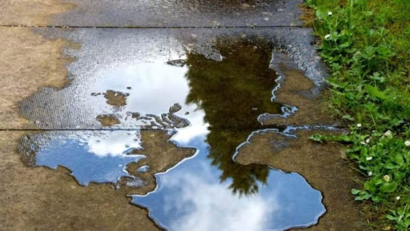 Water leakage reduction illustrated by a leaking water pipe creating a puddle on a patio