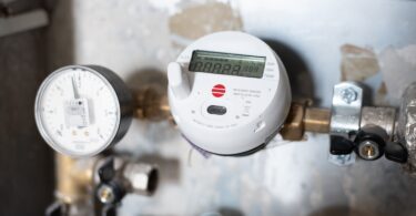 Digital water meter installed in a utility system