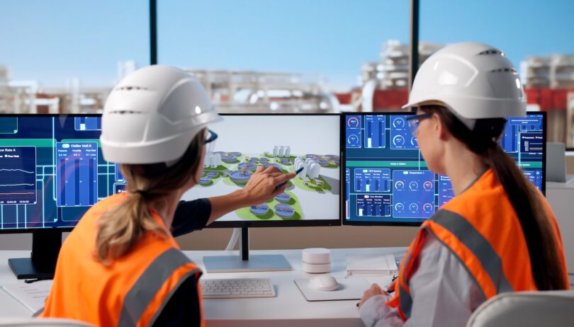 Water engineers reviewing digital treatment plant data