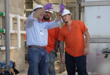 Wastewater professionals examine material recovered during wastewater treatment as part of research into non-flushable wipes.