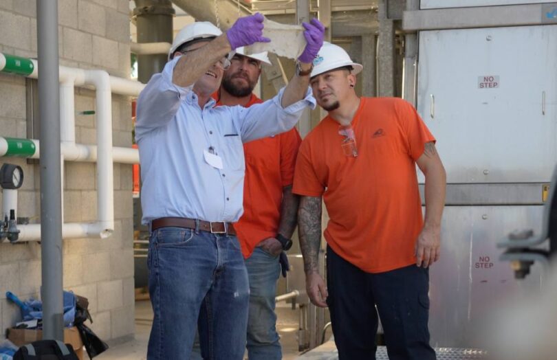 Wastewater professionals examine material recovered during wastewater treatment as part of research into non-flushable wipes.
