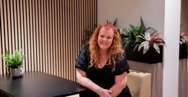 Lissa Wood, Director of SME Customers at Wave, seated in the company’s office