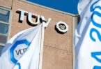 T&Uuml;V S&Uuml;D building with branded flags outside