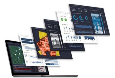 Water system visualisation dashboards displayed above a laptop