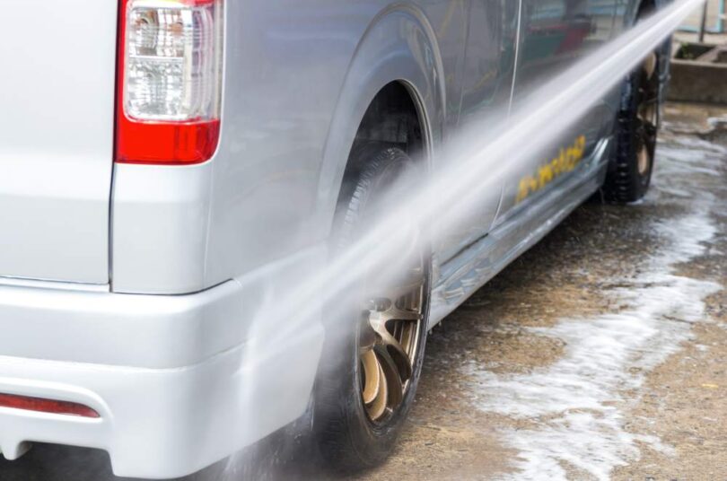 Vehicle being washed with water during South West Water drought restrictions