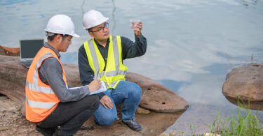 Environmental engineers inspect water quality, bringing water samples to a lab to test mineral content and chemical contamination.