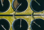 Stock photo titled 'Sewage farm', showing a wastewater treatment site.