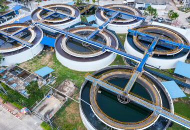 Overhead aerial drone view looking straight down into a clarifier sedimentation tank.