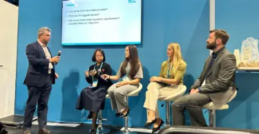 Five CREWW representatives standing at the University of Exeter exhibition stand during the IWA World Water Congress in Glasgow
