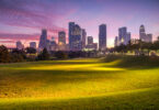 Houston skyline silhouetted against a dawn sky